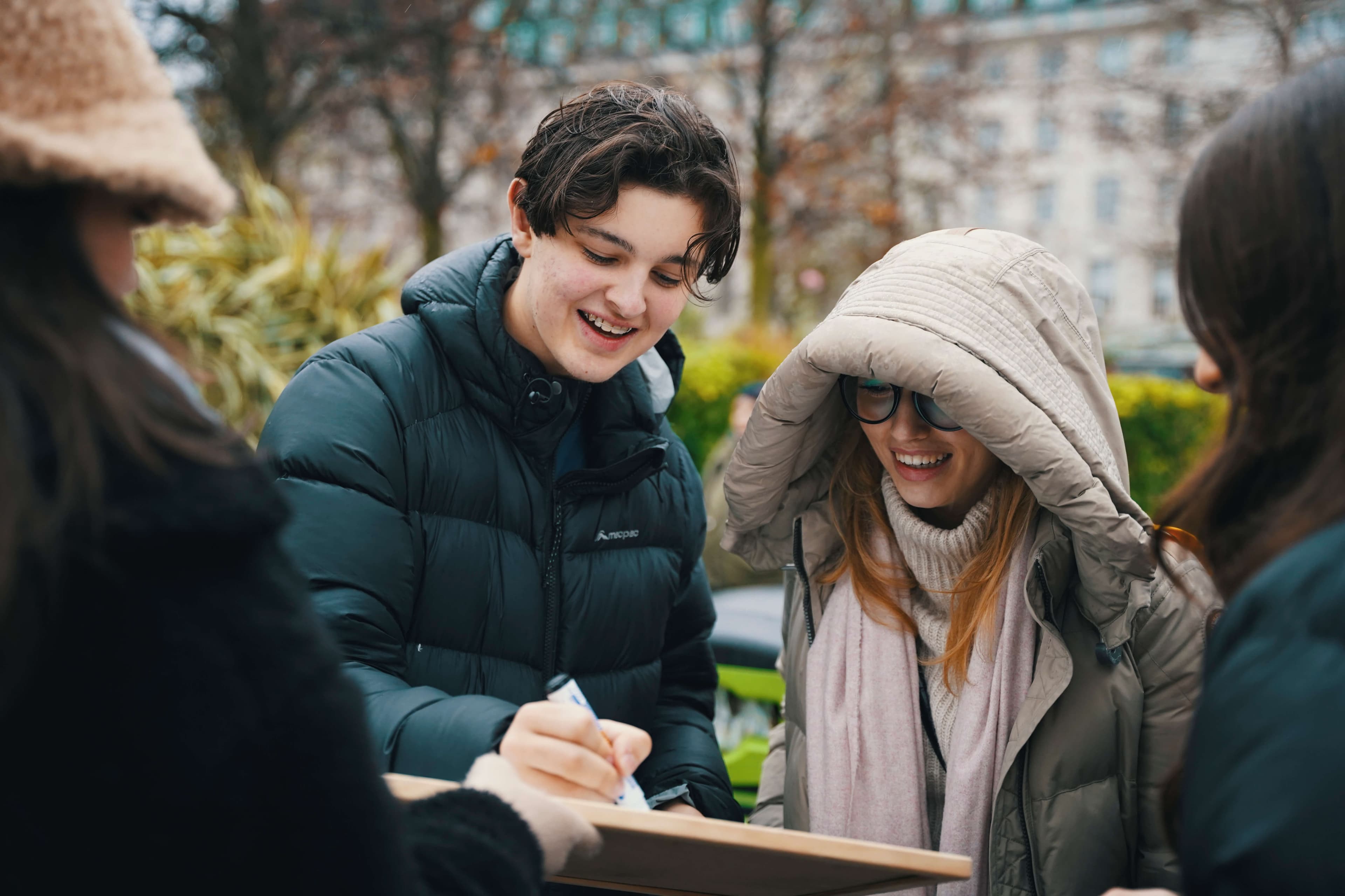 A member of the public writing a message of hope
