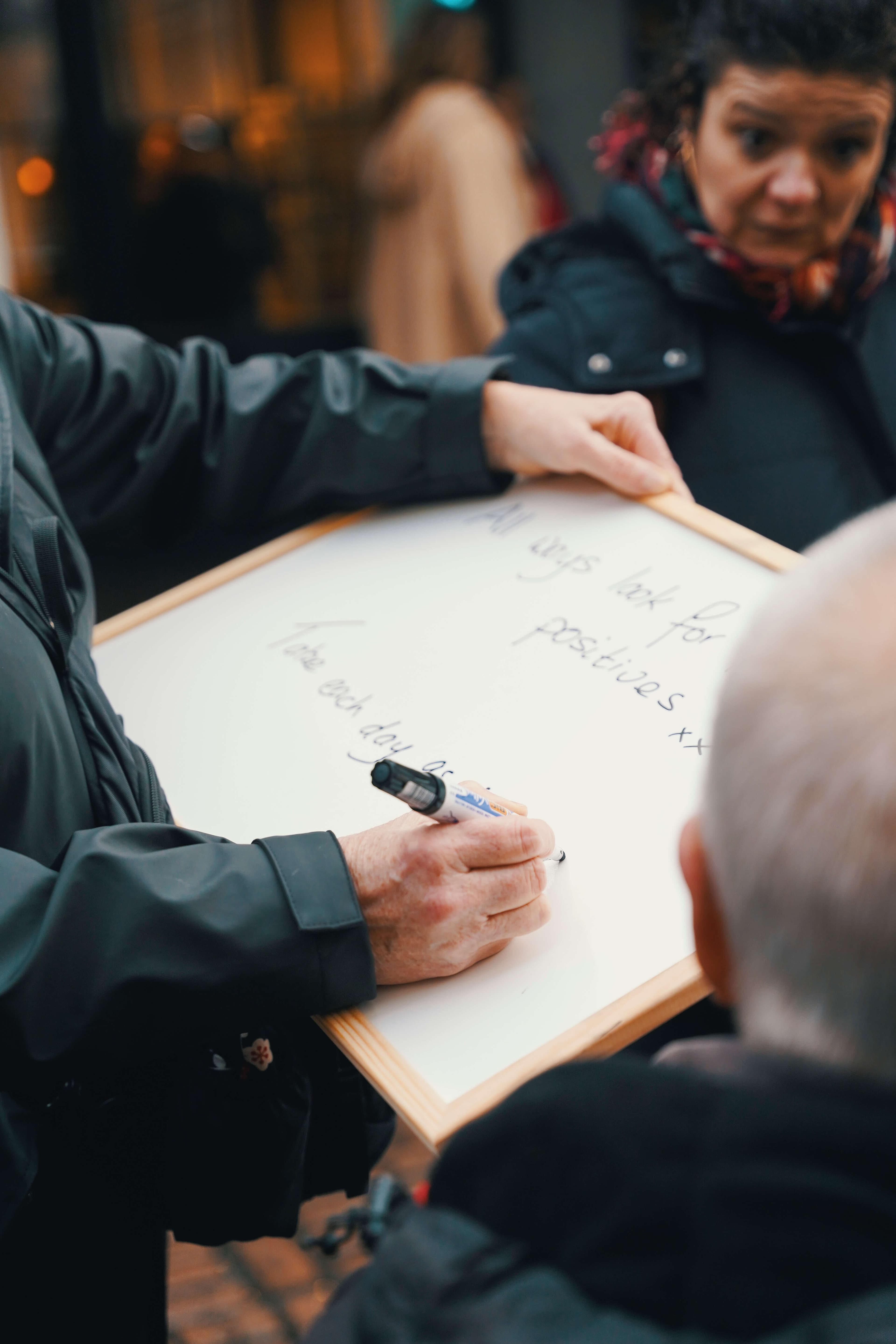 A member of the public writing a message of hope